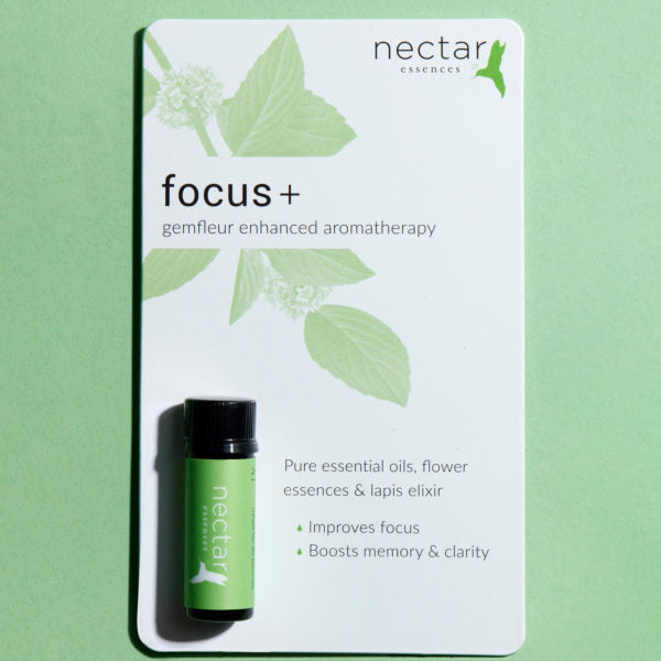 Product card for 'focus+ gemfleur enhanced aromatherapy.' Features a teal-labeled oil bottle and text listing benefits: focus improve, memory boost & clear