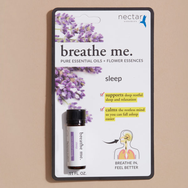 Small packing of breathe me essential oil sleep with beige background