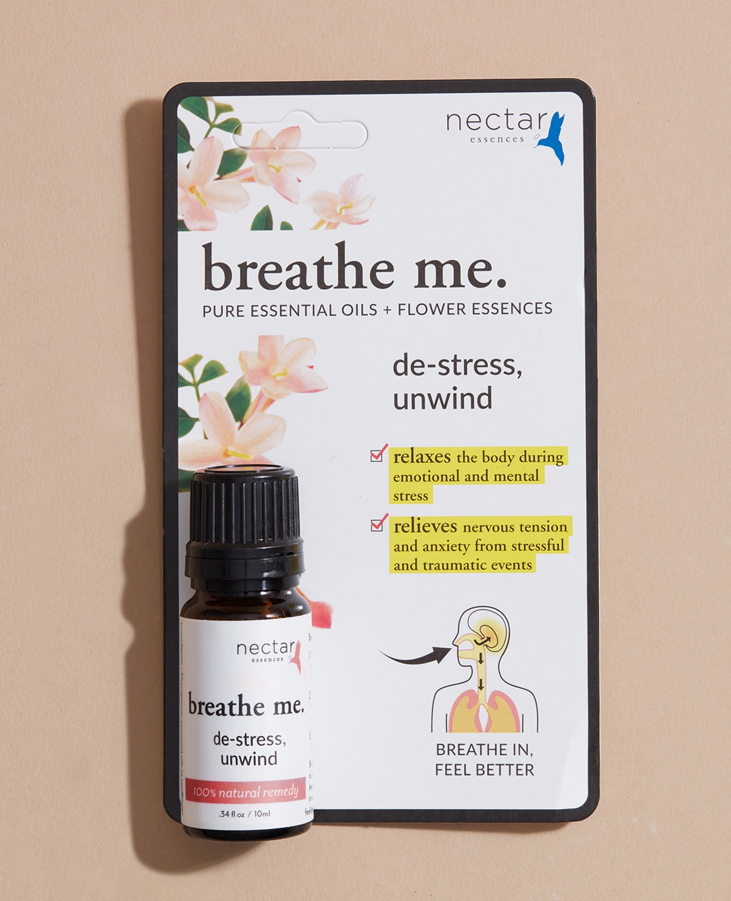 Nectar breathe me essential oil de stress unwind bottle and packaging on a beige background