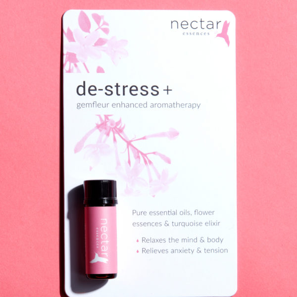 Product card for 'des-stress+ gemfleur enhanced aromatherapy.' Features a teal-labeled oil bottle and text listing benefits: mind & body relax, relieves anxiety & tension