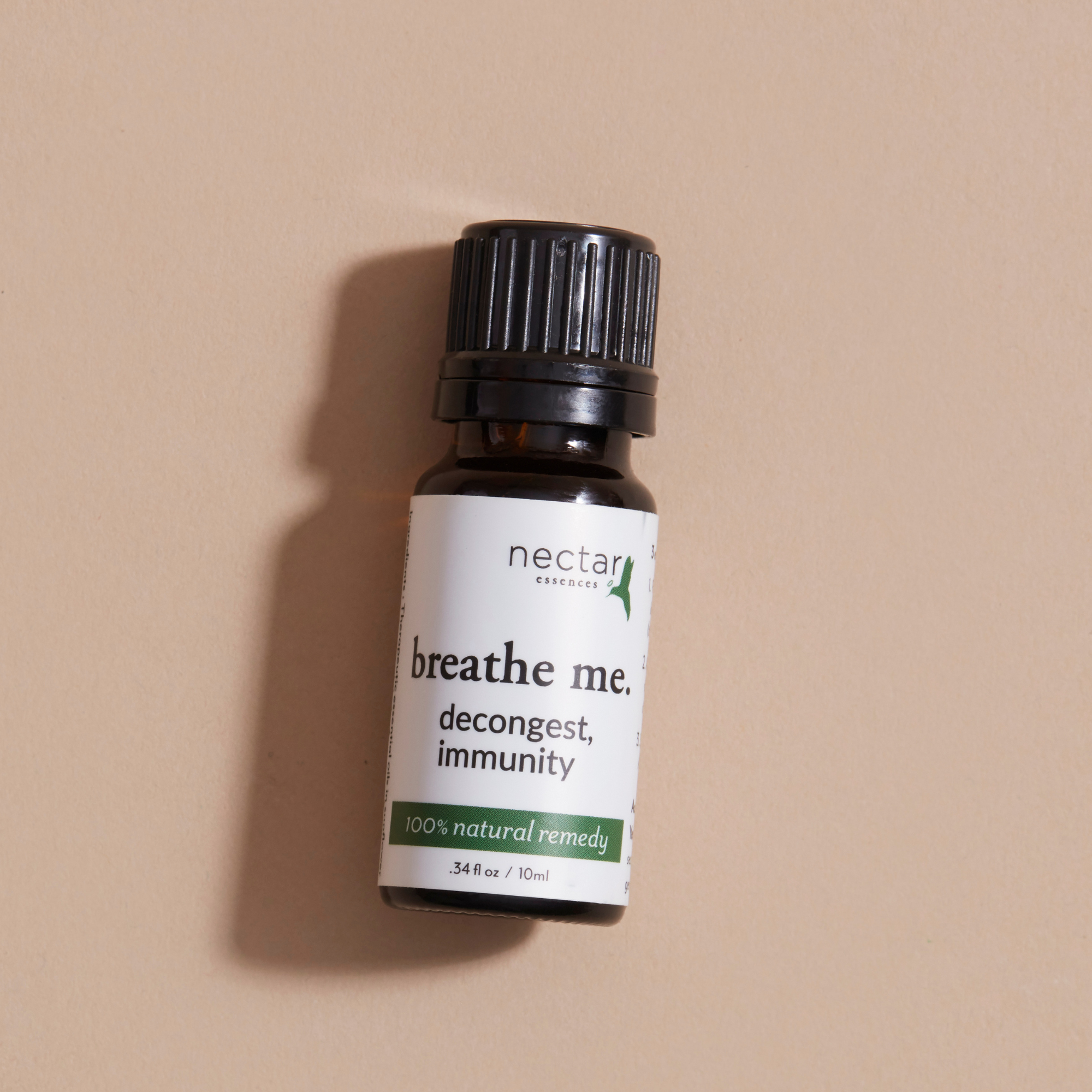 Bottle of 'breathe me' natural remedy with a beige background