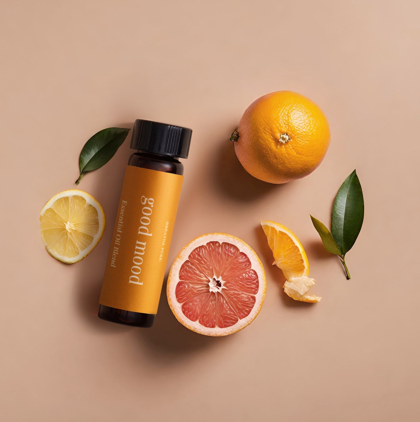 A bottle of 'good mood diffuser oil' with citrus fruits and leaves around it on a beige background.
