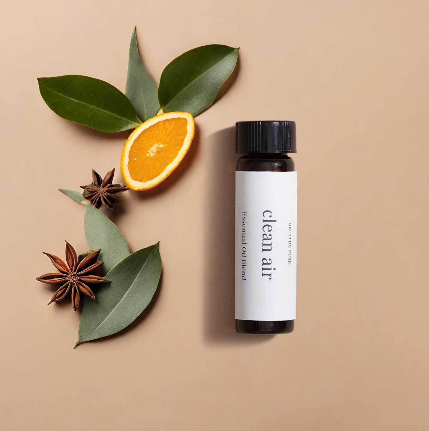 Top-down view of Clean Air essential oil blend bottle with orange, eucalyptus, and star anise for purifying the air.