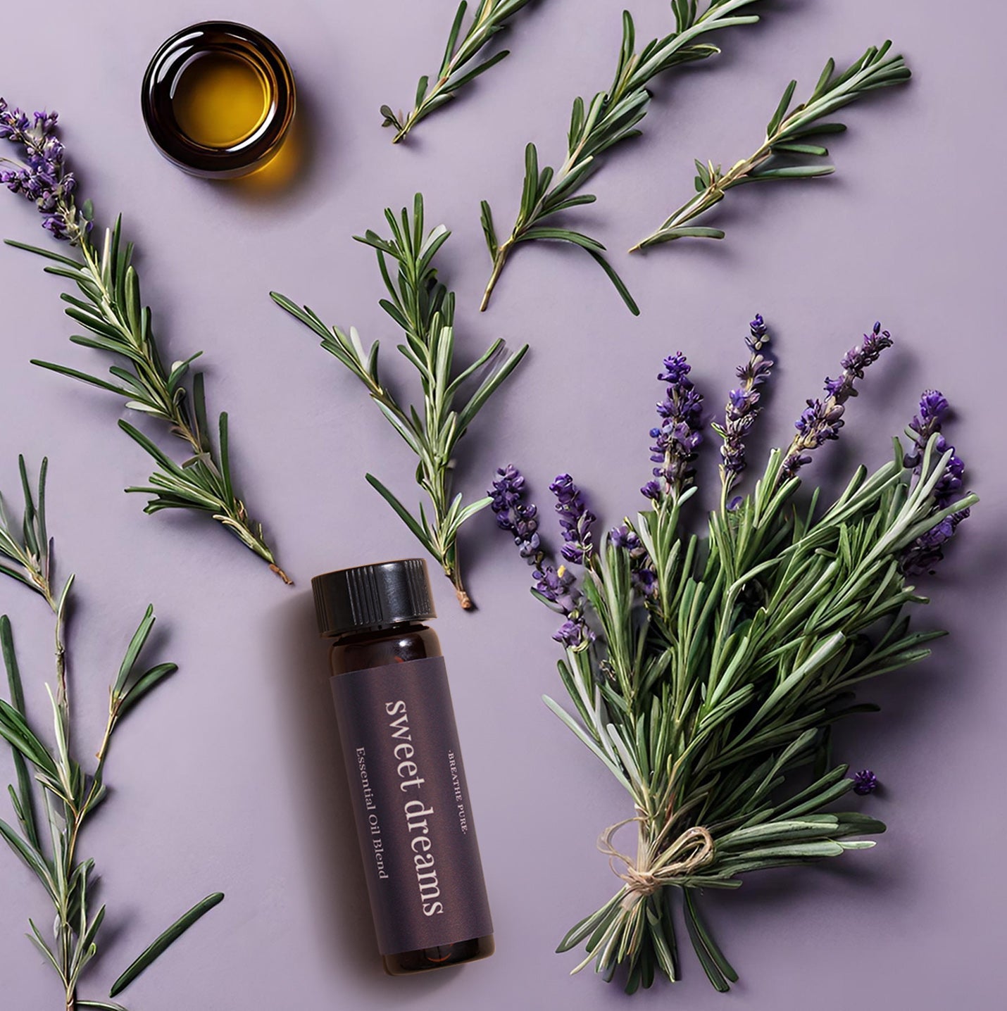 Top-down flat lay view of Sweet Dreams essential oil blend with a bundled bouquet of lavender and rosemary sprigs.
