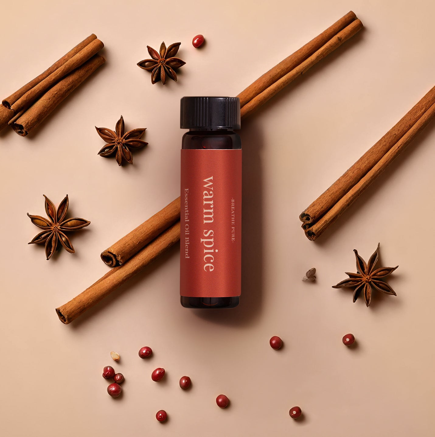 Warm Spice essential oil blend bottle flat lay with cinnamon sticks and star anise for seasonal warmth.
