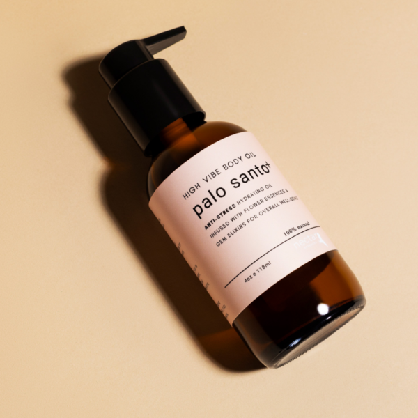 High Vibe Palo Santo Plus Anti-Stress Hydrating Body Oil in an amber glass pump bottle on a clean beige background.