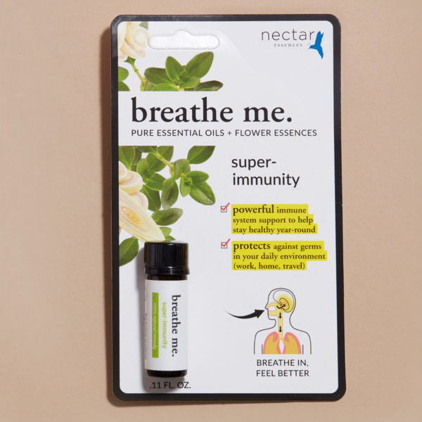 Small packing of breathe me essential oil super immunity with beige background